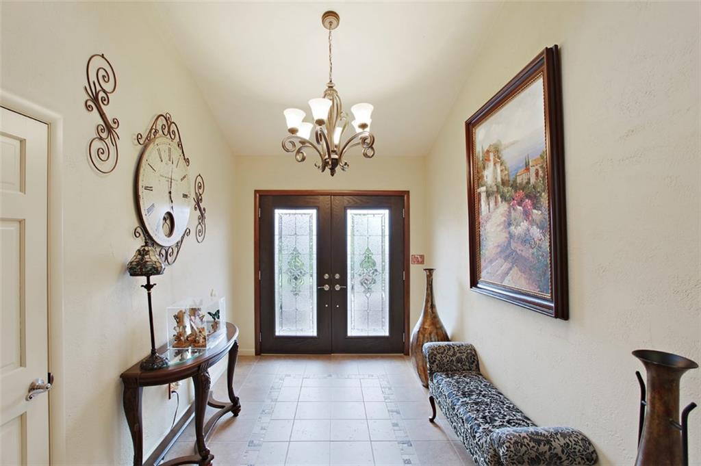 576 New Texas Road Pittsburgh, PA 15239 - Photo 7 of 25 Welcoming etched glass double doors open wide to enter this foyer with unique designed tile flooring pattern & guest closet.