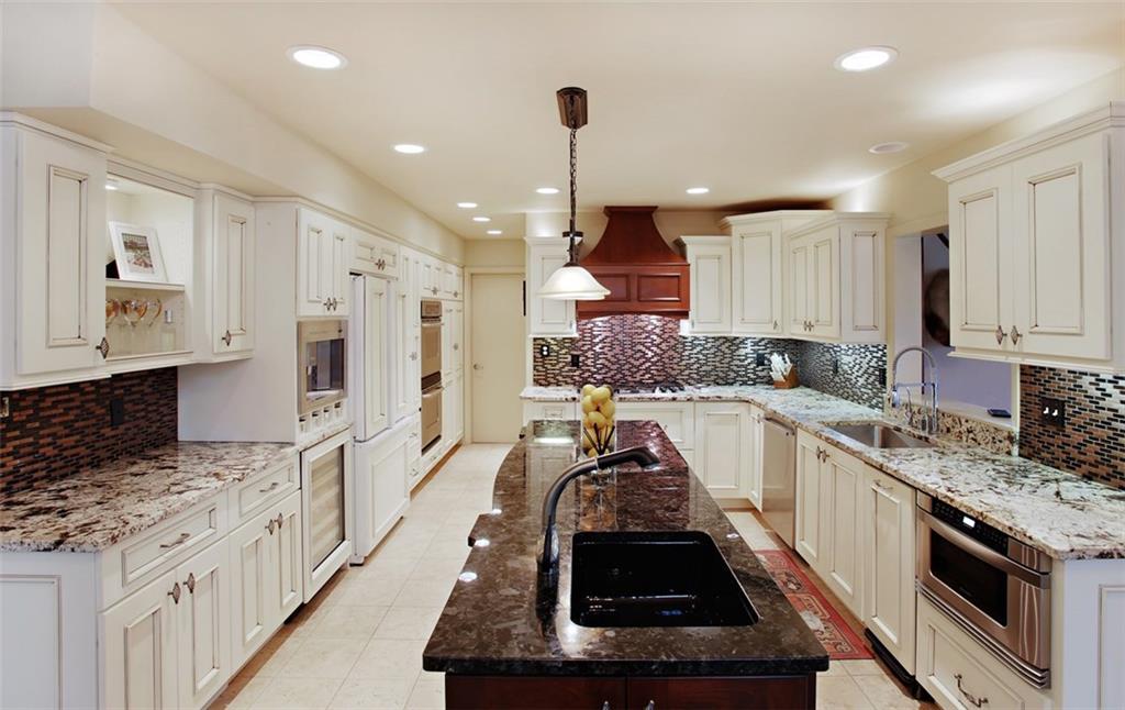 576 New Texas Road Pittsburgh, PA 15239 - Photo 10 of 25 Note the generous kitchen island complete with 2nd sink as well as the under counter microwave, double oven & wine cooler