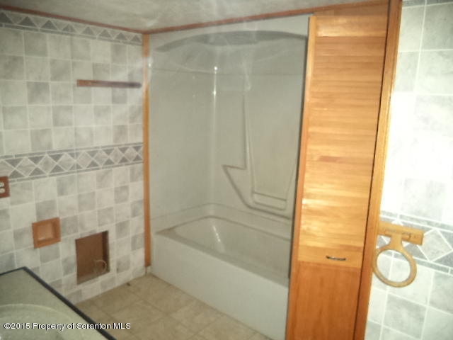 689 Fields Brook Road Nicholson, PA 18446 - Photo 12 of 14 a bathroom with a bathtub and shower
