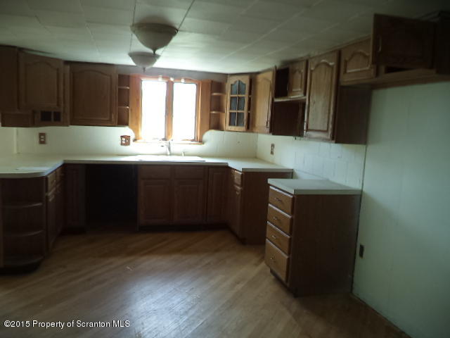 689 Fields Brook Road Nicholson, PA 18446 - Photo 3 of 14 a kitchen with stainless steel appliances granite countertop a sink and a stove