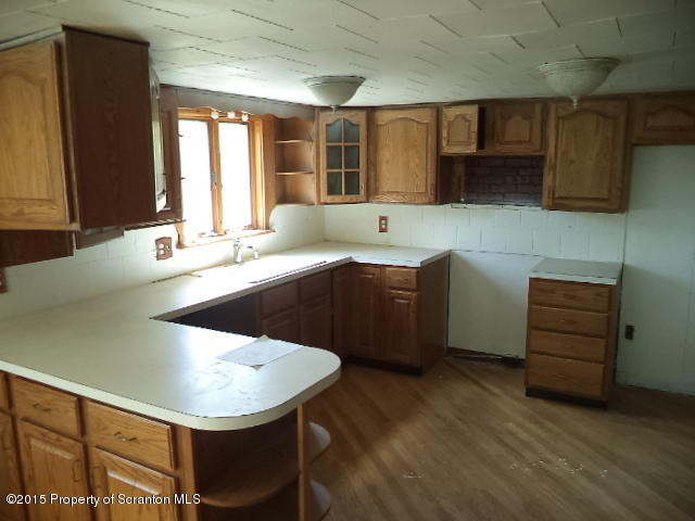 689 Fields Brook Road Nicholson, PA 18446 - Photo 4 of 14 a kitchen with a sink cabinets and window