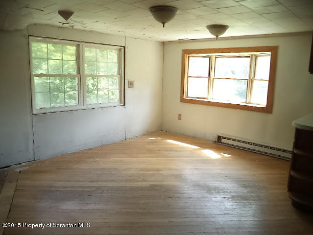 689 Fields Brook Road Nicholson, PA 18446 - Photo 5 of 14 a view of an empty room with a window