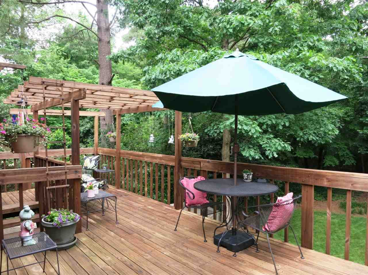 613 Compton Road Raleigh, NC 27609 - Photo 22 of 25 The lg Deck overlooks the PRIVATE backyard surrounded by trees! Deck