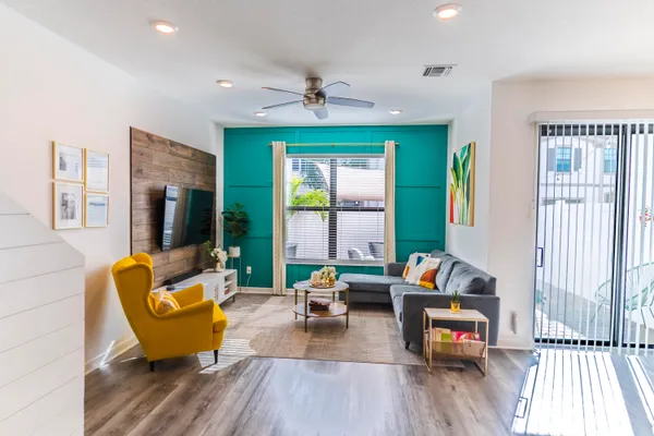 a living room with furniture and a large window