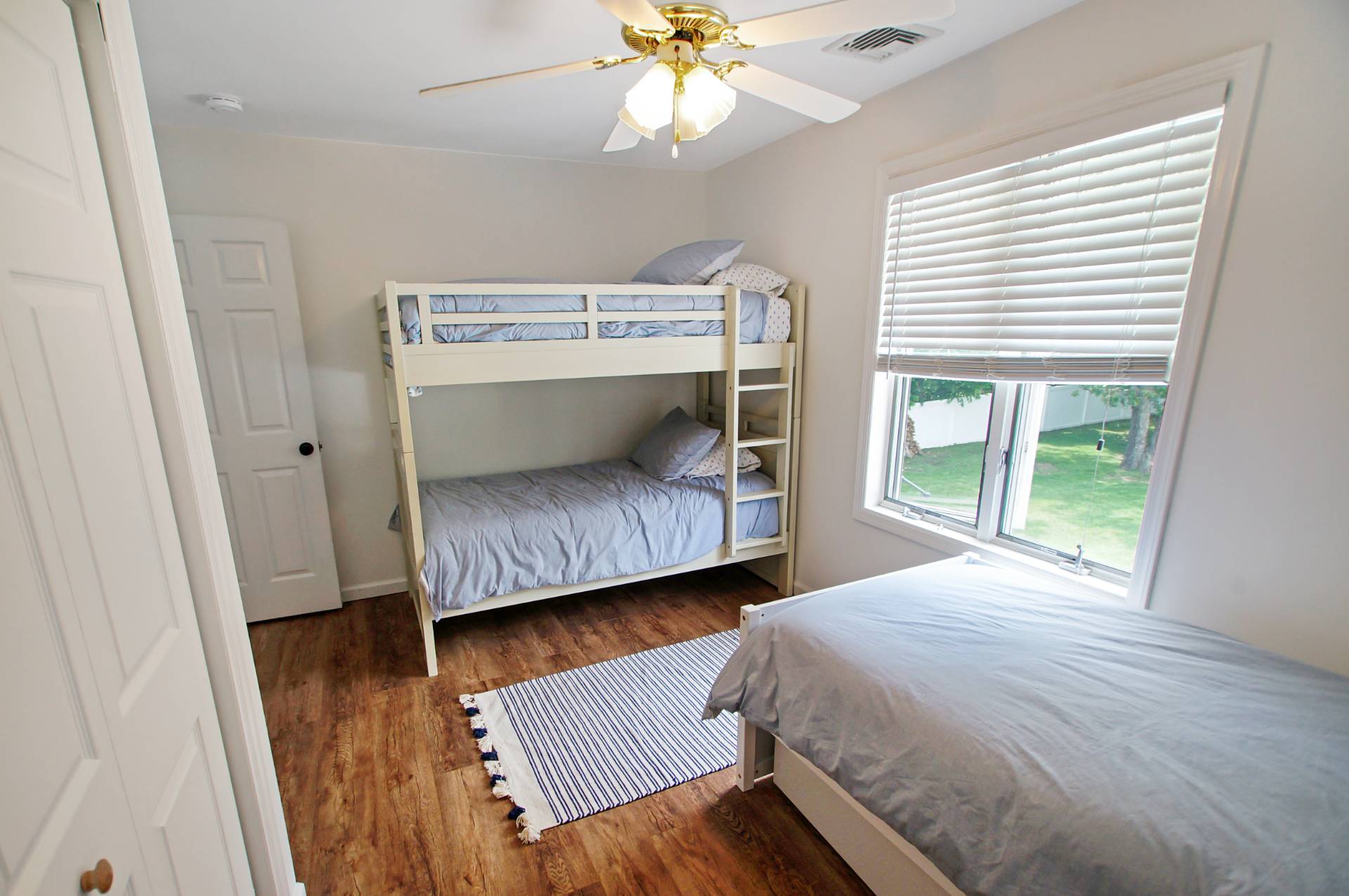 16 Norbury Road Hampton Bays, NY 11946 - Photo 12 of 32 a bedroom with a bed and a window