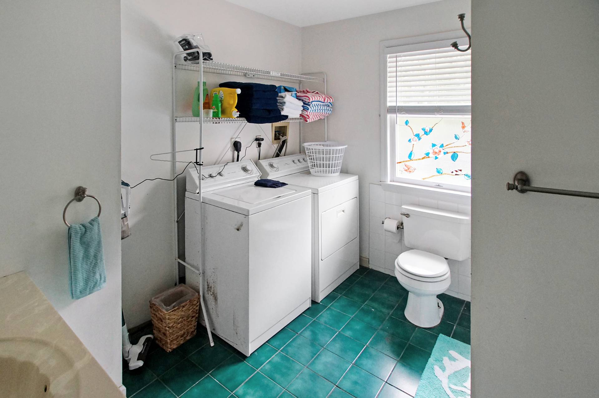 16 Norbury Road Hampton Bays, NY 11946 - Photo 16 of 32 a bathroom with a toilet sink and mirror