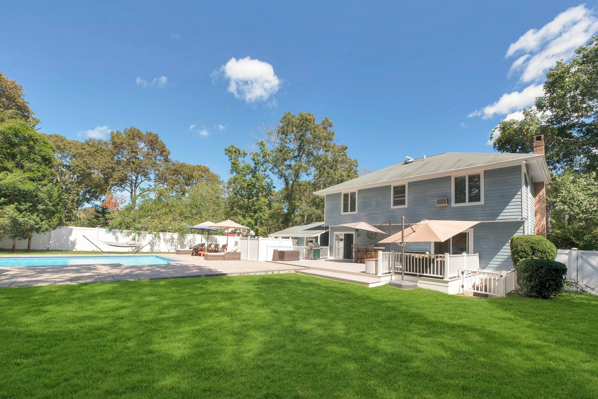 16 Norbury Road Hampton Bays, NY 11946 - Photo 25 of 32 a front view of house with yard and green space