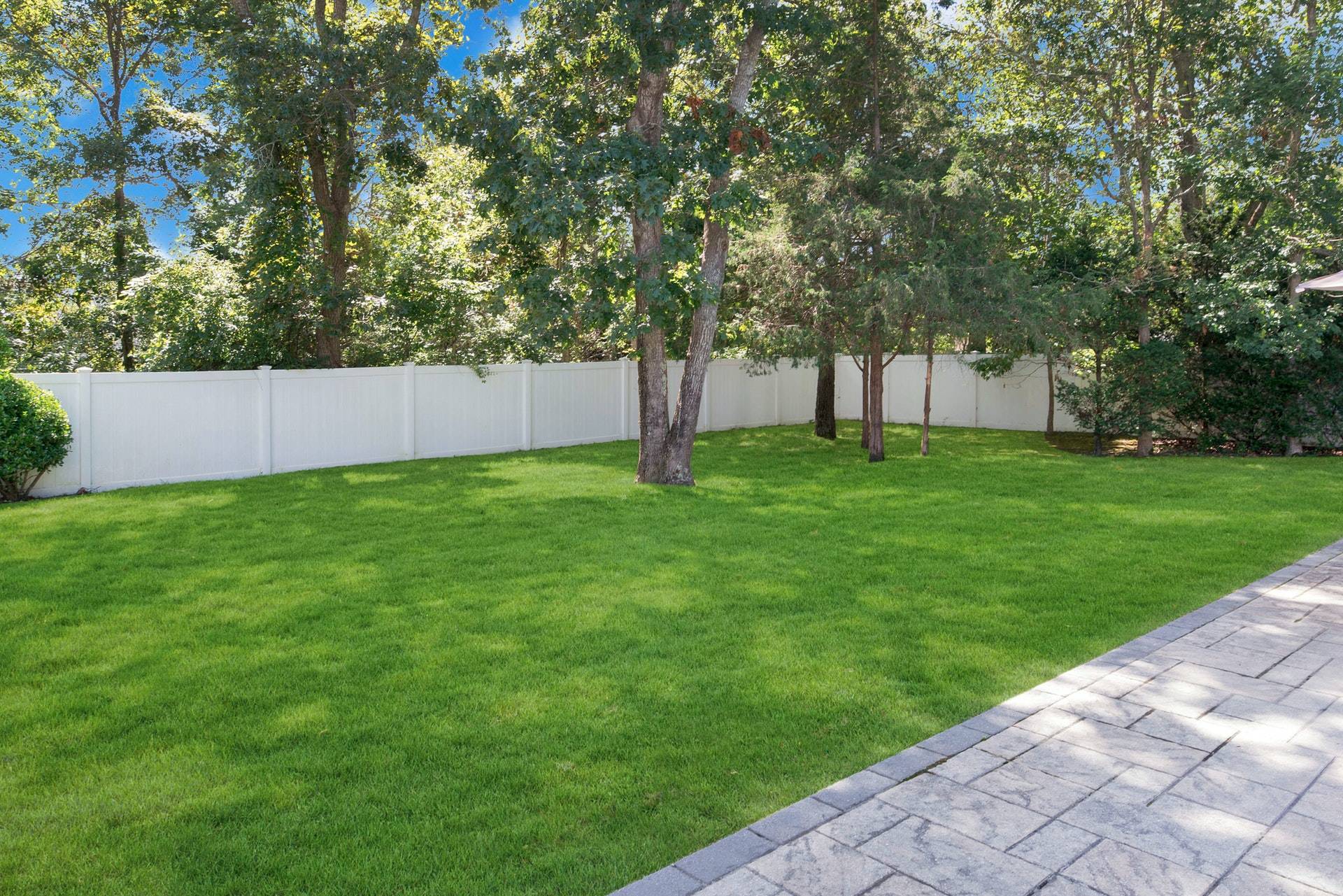 16 Norbury Road Hampton Bays, NY 11946 - Photo 27 of 32 a view of a backyard with large trees