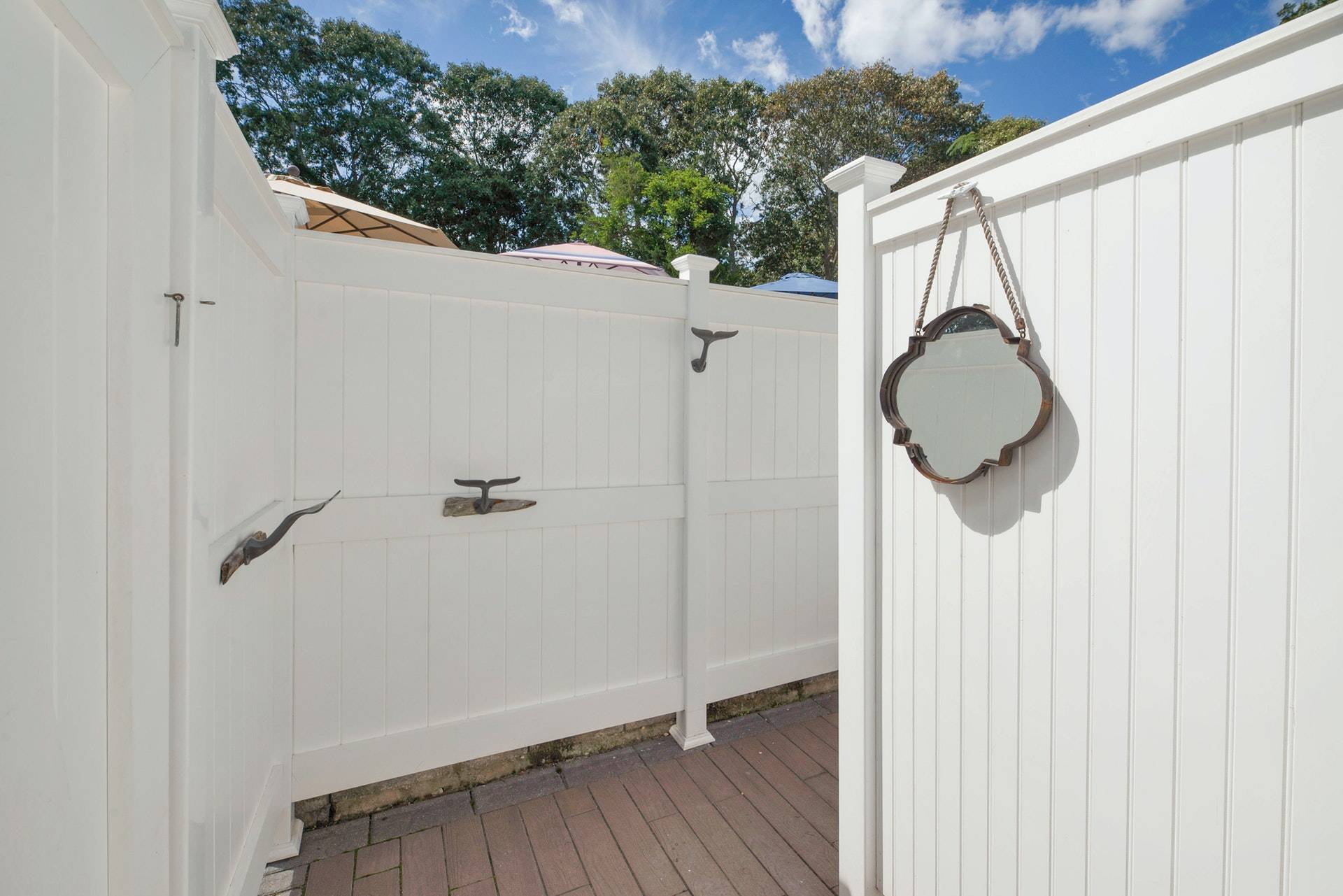 16 Norbury Road Hampton Bays, NY 11946 - Photo 31 of 32 a view of a room with wooden floor and mirror