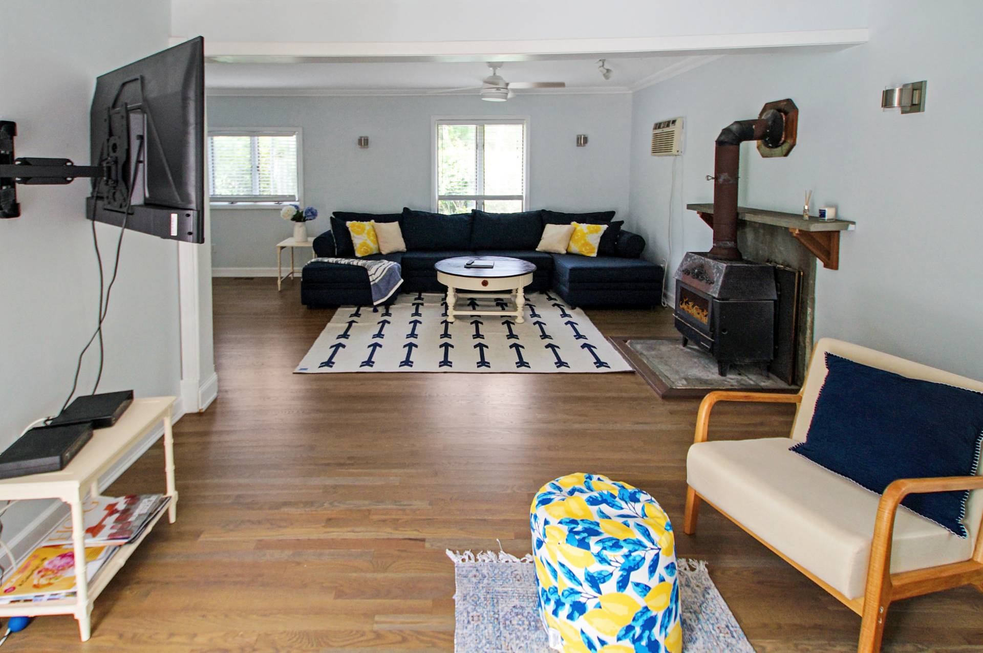 16 Norbury Road Hampton Bays, NY 11946 - Photo 7 of 32 a living room with furniture and a flat screen tv