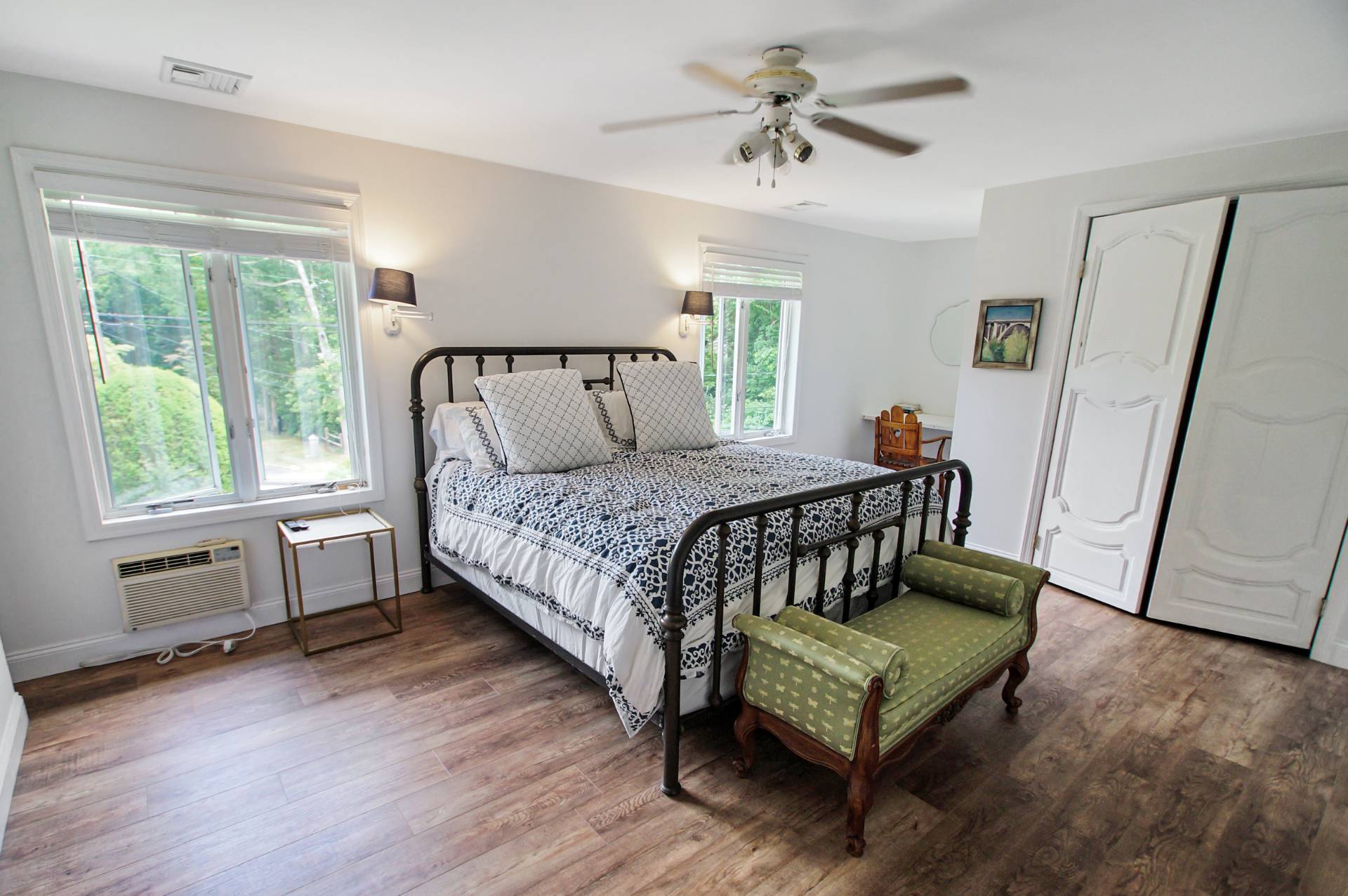 16 Norbury Road Hampton Bays, NY 11946 - Photo 10 of 32 a bedroom with a bed window and a table