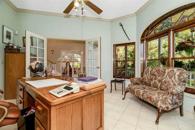 a kitchen with stainless steel appliances granite countertop a stove a refrigerator and a dining table with wooden floor