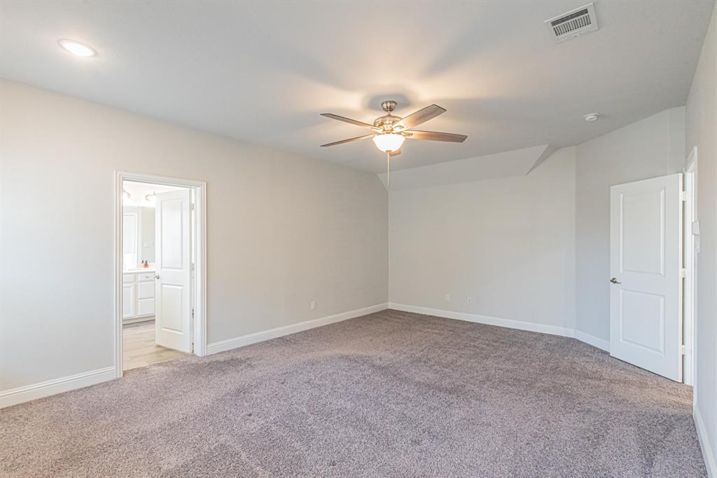 304 Adam Way Euless, TX 76040 - Photo 19 of 39 Unfurnished bedroom featuring light colored carpet, a ceiling fan, and ensuite bathroom