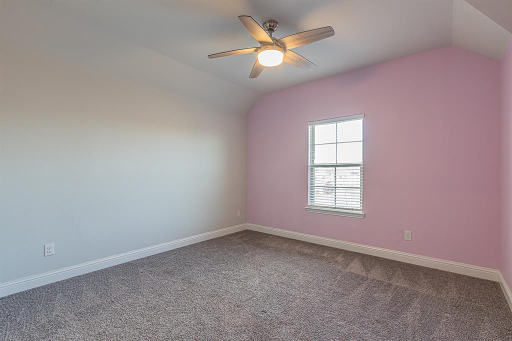 304 Adam Way Euless, TX 76040 - Photo 24 of 39 Additional living space featuring lofted ceiling, ceiling fan, and dark carpet