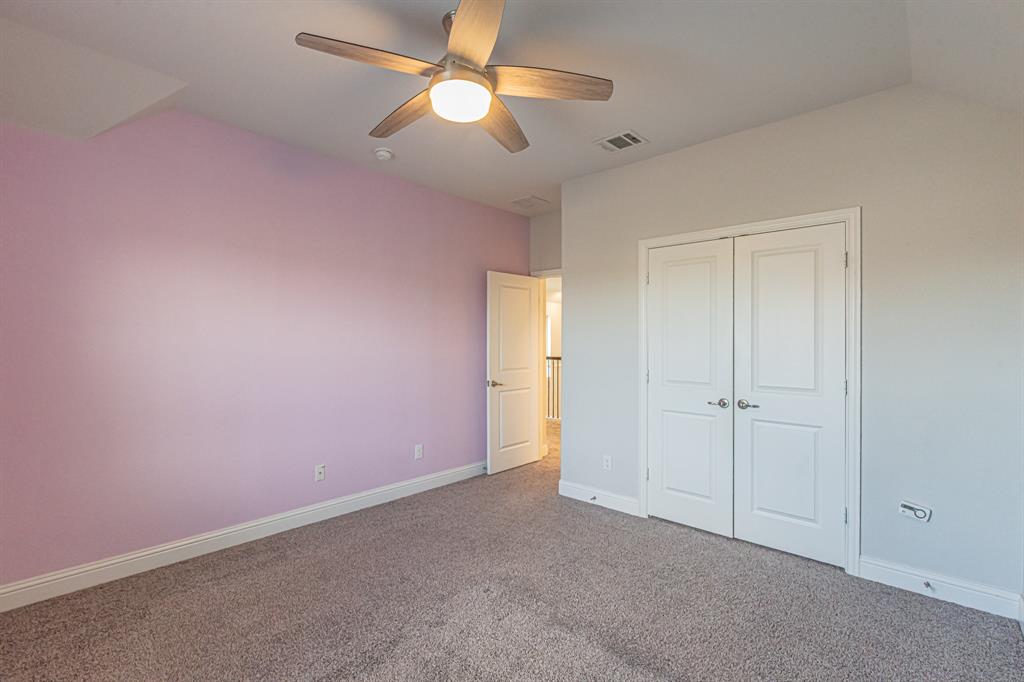 304 Adam Way Euless, TX 76040 - Photo 25 of 39 Unfurnished bedroom with carpet flooring, ceiling fan, and a closet