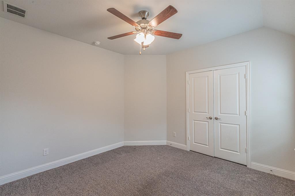 304 Adam Way Euless, TX 76040 - Photo 27 of 39 Unfurnished bedroom with carpet flooring, a ceiling fan, and a closet