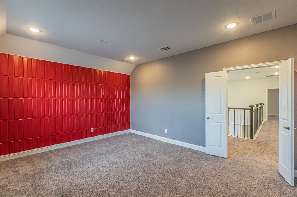 304 Adam Way Euless, TX 76040 - Photo 29 of 39 Empty room with lofted ceiling and carpet floors