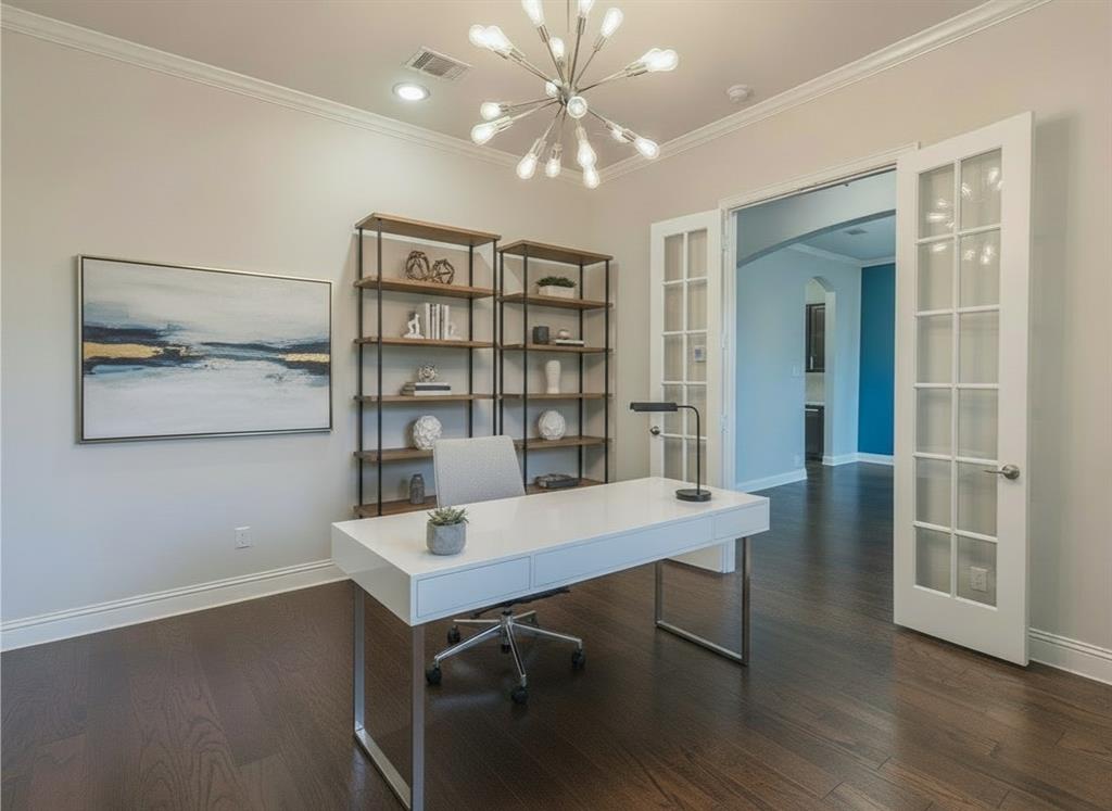 304 Adam Way Euless, TX 76040 - Photo 5 of 39 Home office featuring arched walkways, ornamental molding, french doors, dark wood finished floors, and hanging lights