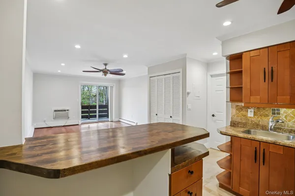 a kitchen with a sink and a window