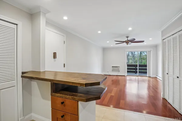 a living room with a table and window