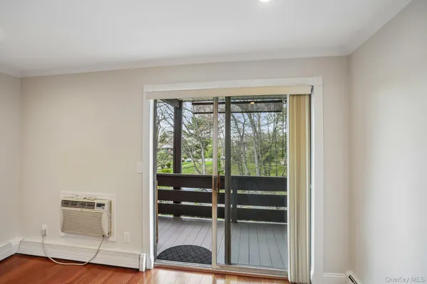 a room with walk in closet and window