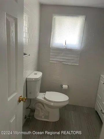 a bathroom with a toilet and a sink