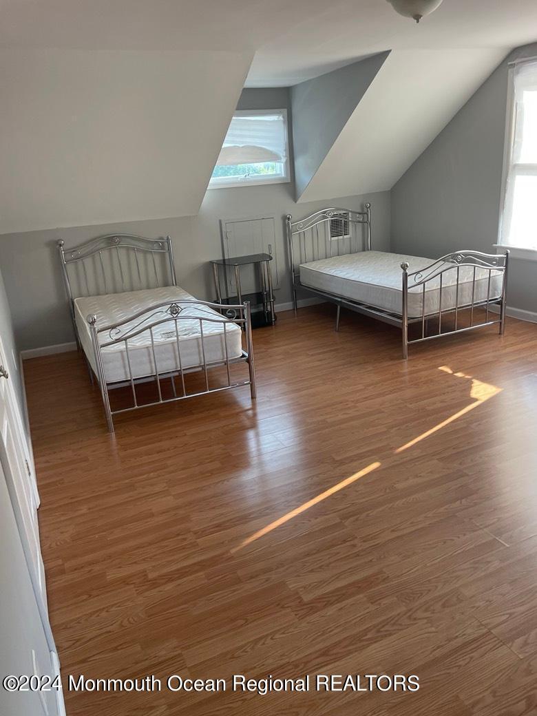 3 Berger Avenue Oakhurst, NJ 07755 - Photo 6 of 12 a room with wooden floor and furniture