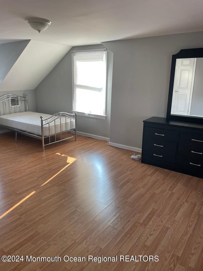 3 Berger Avenue Oakhurst, NJ 07755 - Photo 7 of 12 a bed room with a bed and a window