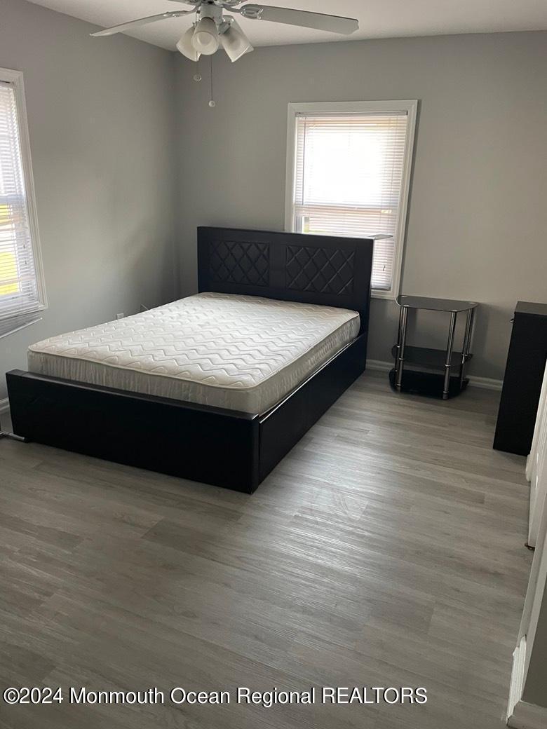 3 Berger Avenue Oakhurst, NJ 07755 - Photo 9 of 12 a bedroom with a bed and window