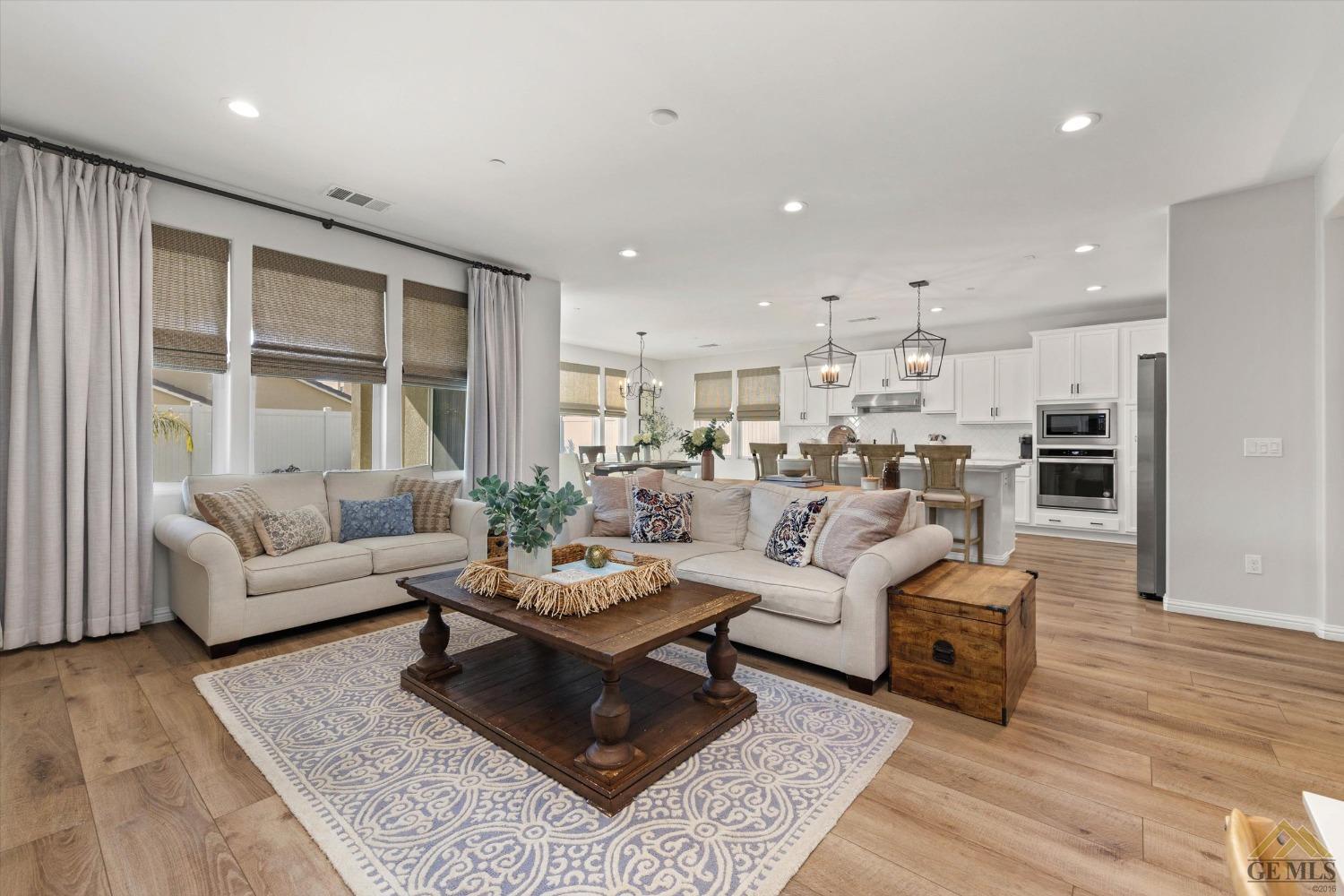 Undisclosed Address Bakersfield, CA 93311 - Photo 11 of 37 a living room with furniture and a large window