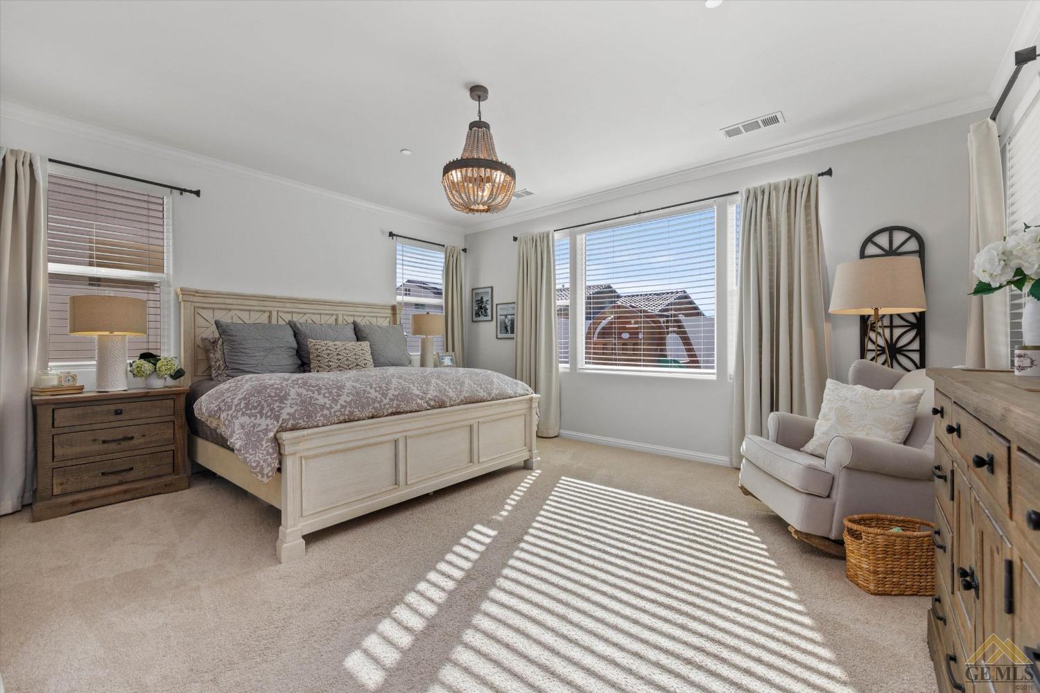 Undisclosed Address Bakersfield, CA 93311 - Photo 21 of 37 a bedroom with a bed and a window