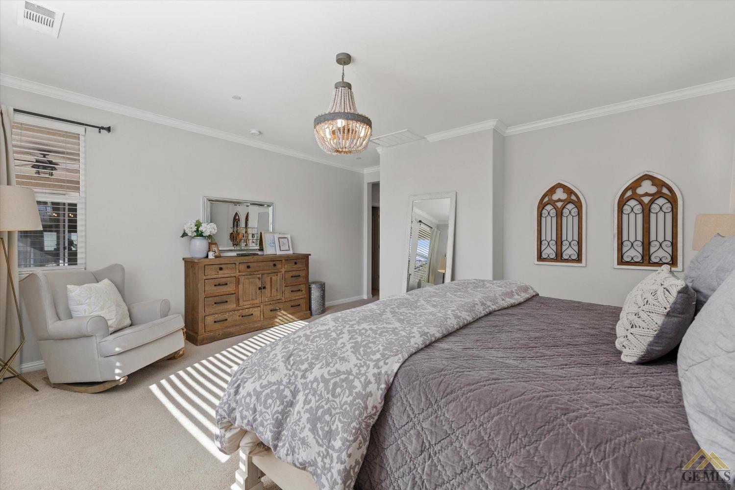 Undisclosed Address Bakersfield, CA 93311 - Photo 22 of 37 a bedroom with a bed and ceiling fan