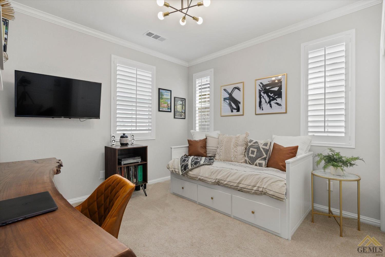 Undisclosed Address Bakersfield, CA 93311 - Photo 26 of 37 a living room with furniture and a flat screen tv