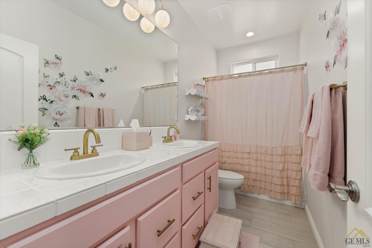 Undisclosed Address Bakersfield, CA 93311 - Photo 27 of 37 a bathroom with a sink a toilet and shower