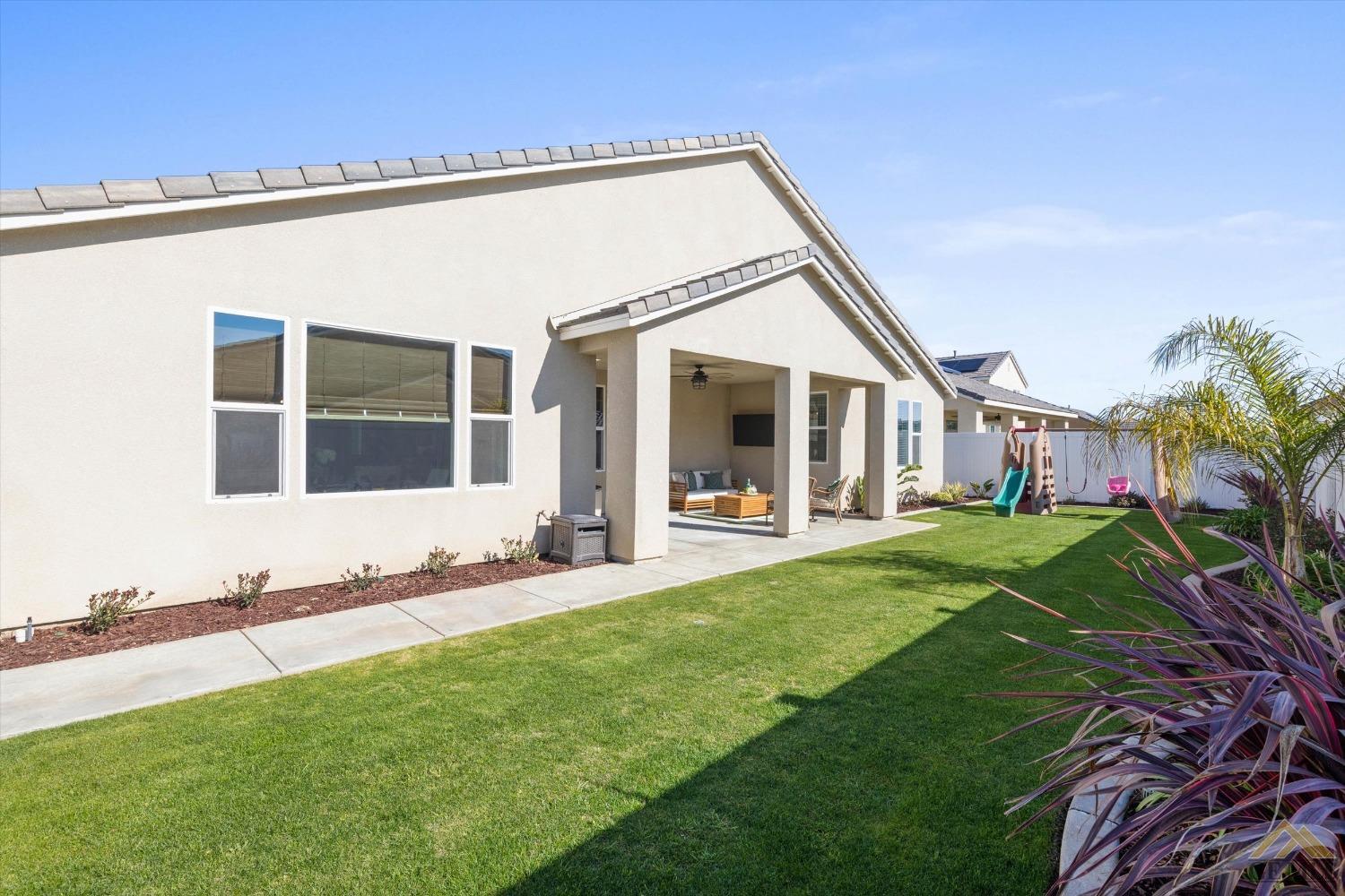 Undisclosed Address Bakersfield, CA 93311 - Photo 36 of 37 a view of a house with backyard and porch