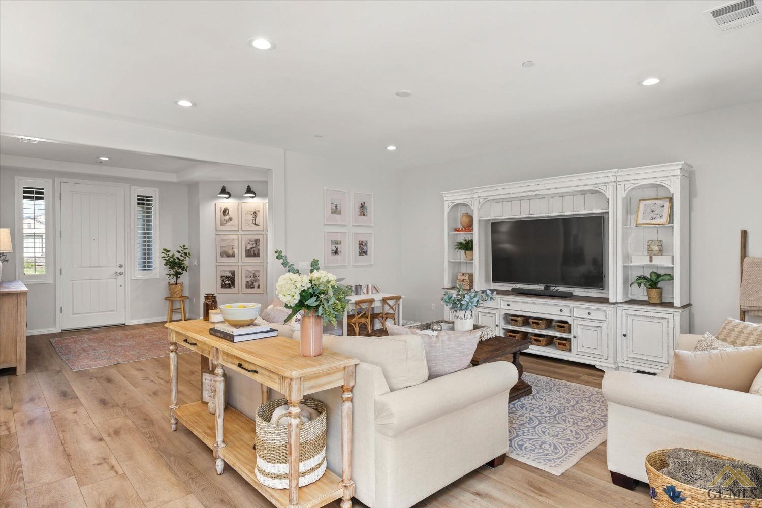 Undisclosed Address Bakersfield, CA 93311 - Photo 10 of 37 a living room with furniture and a flat screen tv