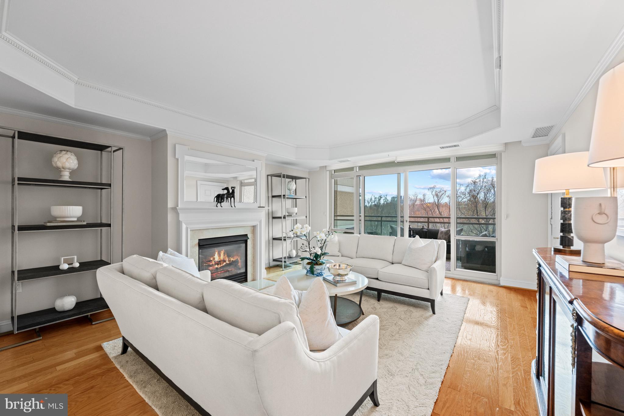 5630 Wisconsin Avenue, Unit 903 Chevy Chase, MD 20815 - Photo 11 of 50 a living room with furniture fireplace and a large window