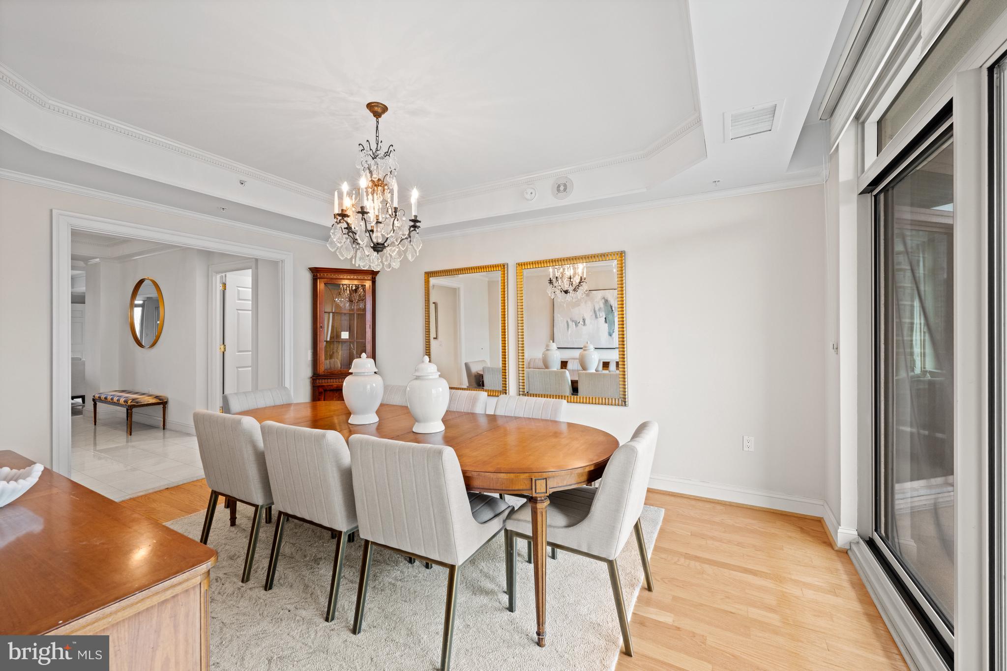 5630 Wisconsin Avenue, Unit 903 Chevy Chase, MD 20815 - Photo 15 of 50 a dining room with furniture and chandelier