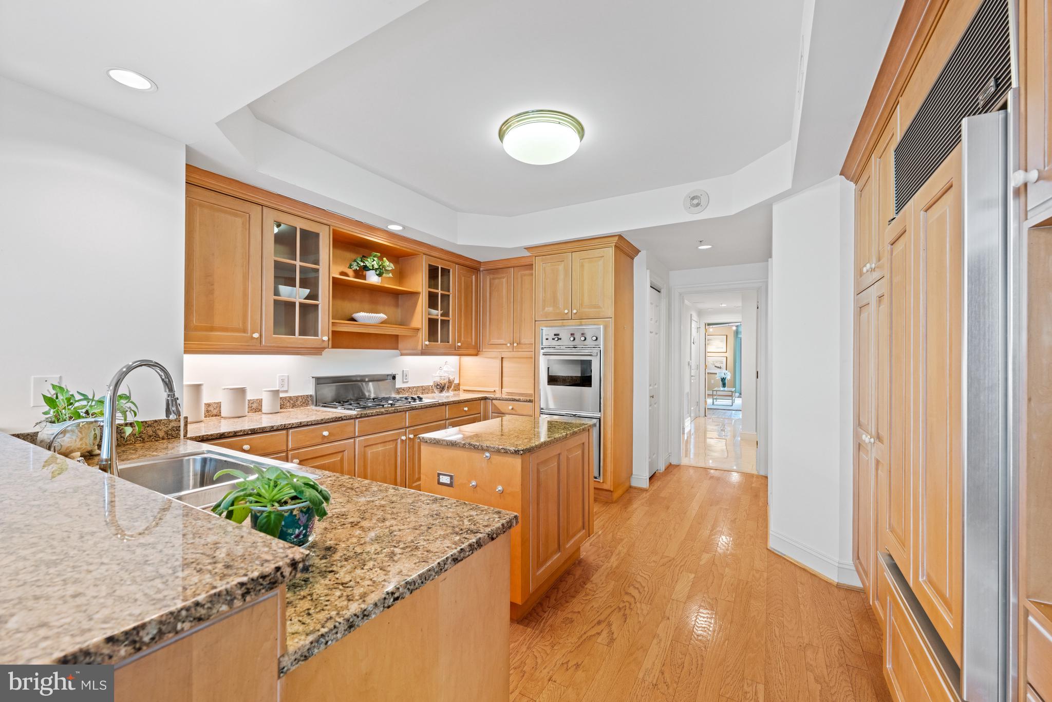 5630 Wisconsin Avenue, Unit 903 Chevy Chase, MD 20815 - Photo 19 of 50 a kitchen with stainless steel appliances granite countertop sink and cabinets