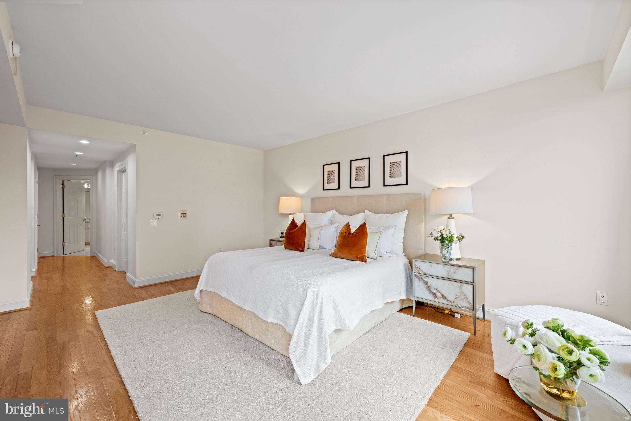 5630 Wisconsin Avenue, Unit 903 Chevy Chase, MD 20815 - Photo 22 of 50 a bedroom with a bed and hallway