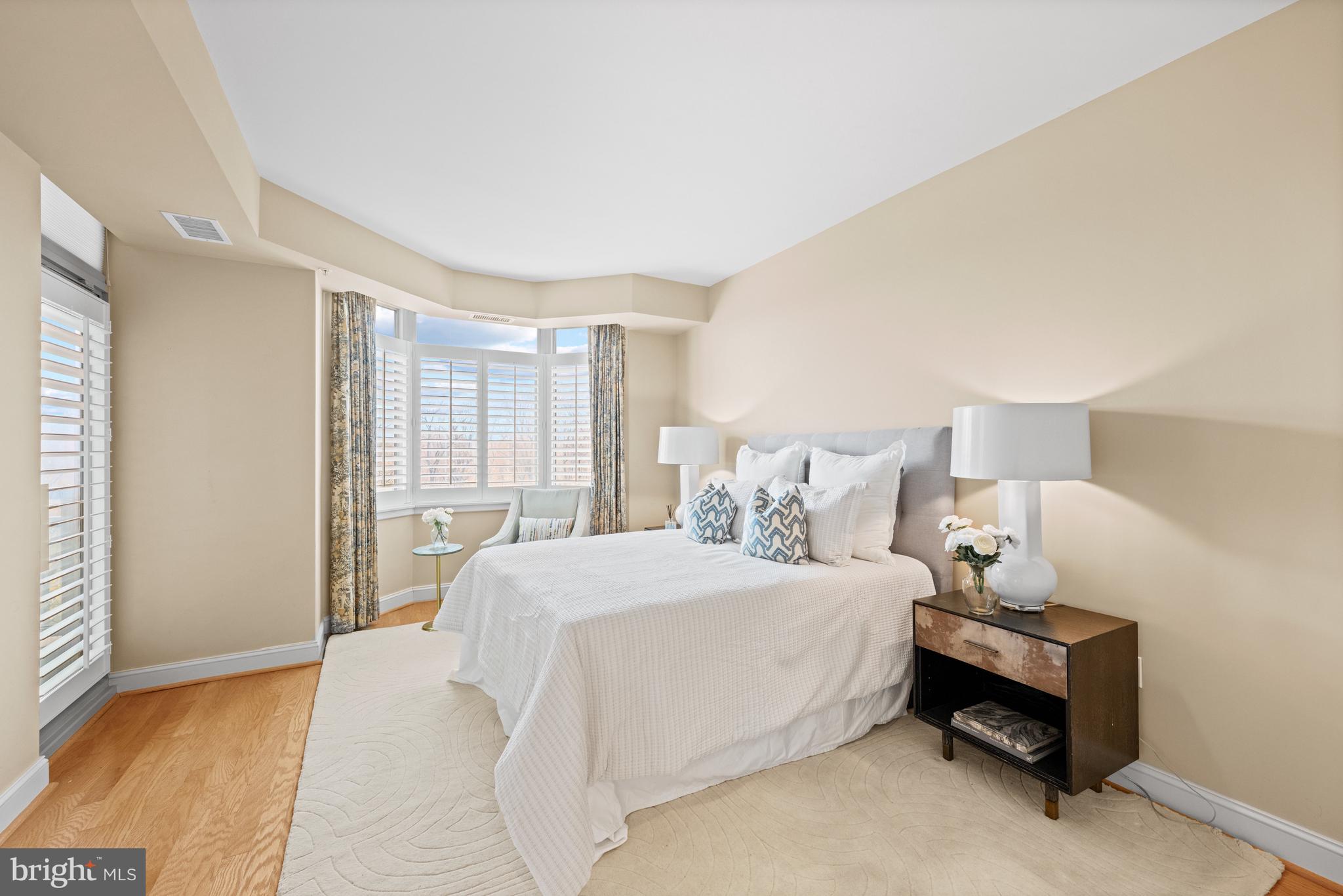 5630 Wisconsin Avenue, Unit 903 Chevy Chase, MD 20815 - Photo 27 of 50 a bedroom with a bed and a couch