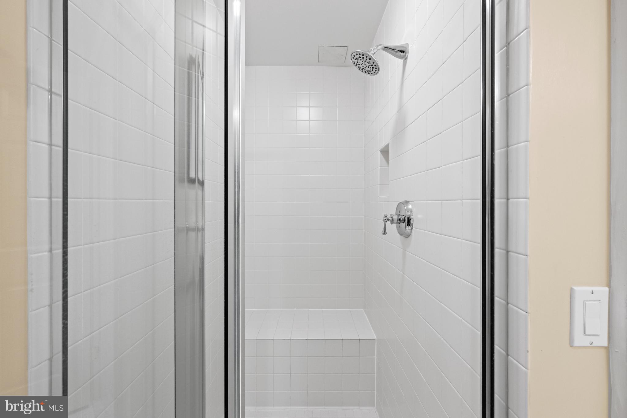 5630 Wisconsin Avenue, Unit 903 Chevy Chase, MD 20815 - Photo 29 of 50 a bathroom with a shower