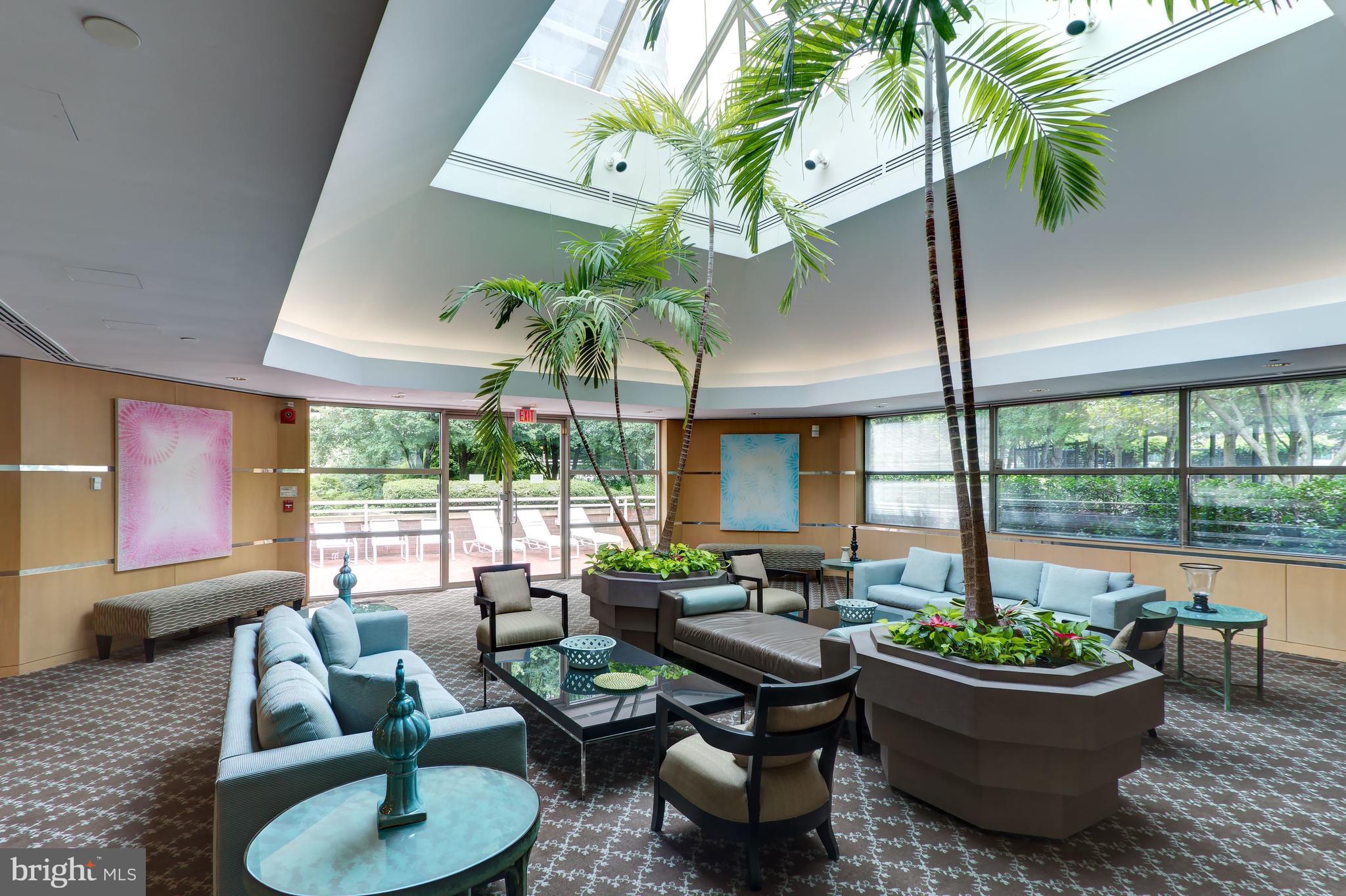 5630 Wisconsin Avenue, Unit 903 Chevy Chase, MD 20815 - Photo 35 of 50 a living room with furniture and a potted plant