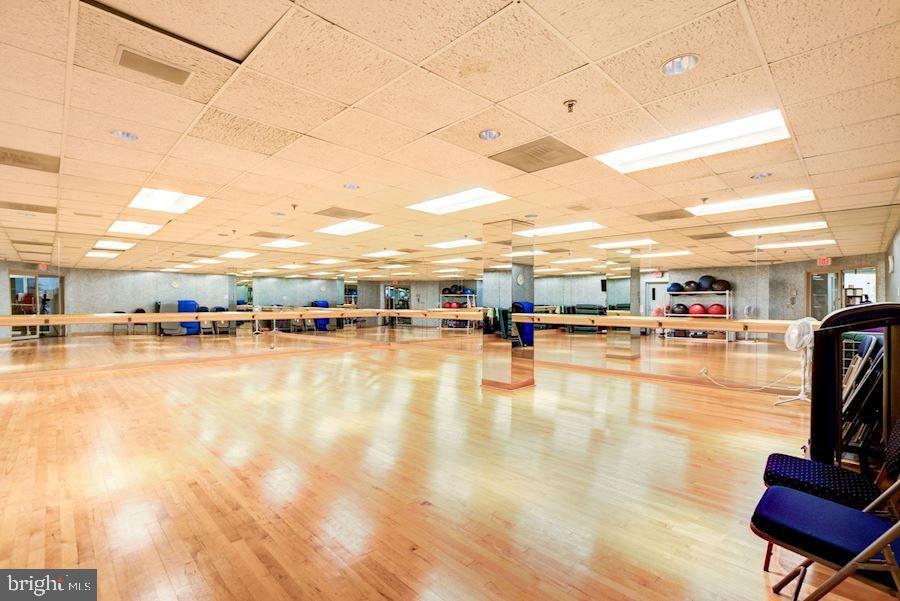 5630 Wisconsin Avenue, Unit 903 Chevy Chase, MD 20815 - Photo 43 of 50 a swimming pool with outdoor seating and yard