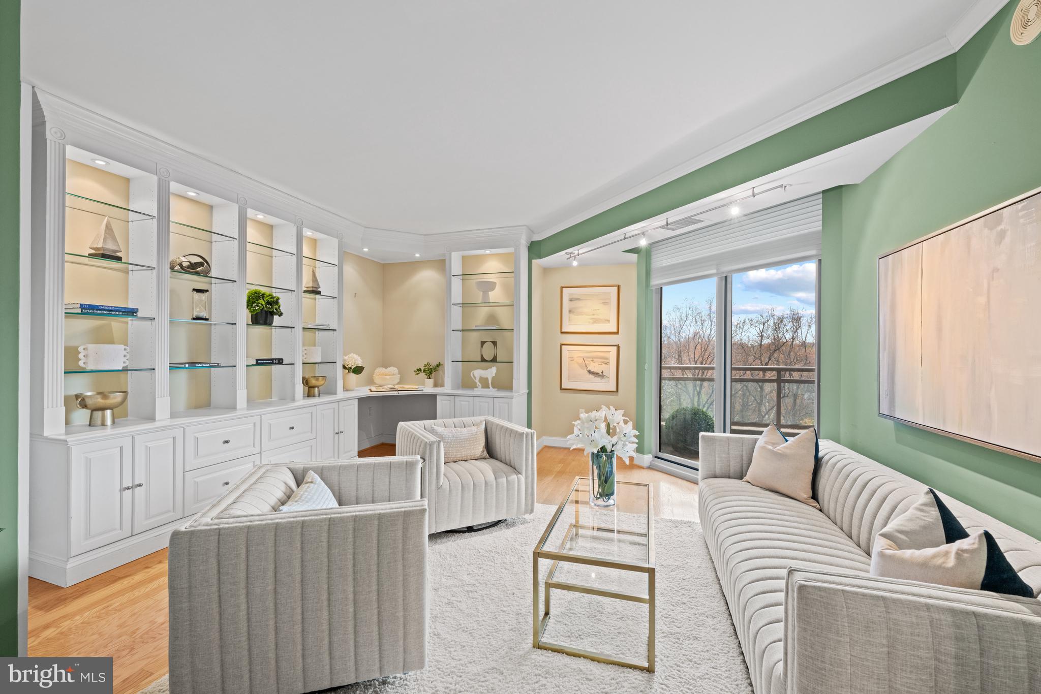 5630 Wisconsin Avenue, Unit 903 Chevy Chase, MD 20815 - Photo 8 of 50 a living room with furniture and a large window