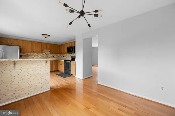 a view of kitchen with wooden floor