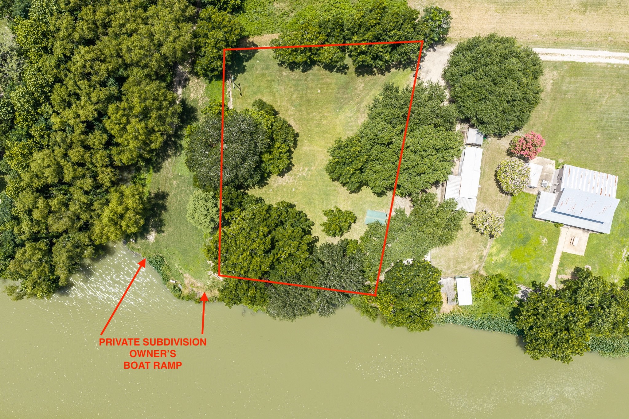 Tbd Goodwin Road Gonzales, TX 78629 - Photo 26 of 33 A verdant parcel bordering the serene waterfront, ideal for a private estate.