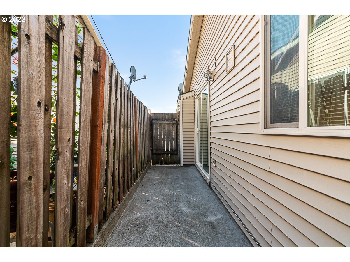993 Southwest Junction Place Gresham, OR 97080 - Photo 19 of 27 a view of a porch with a door