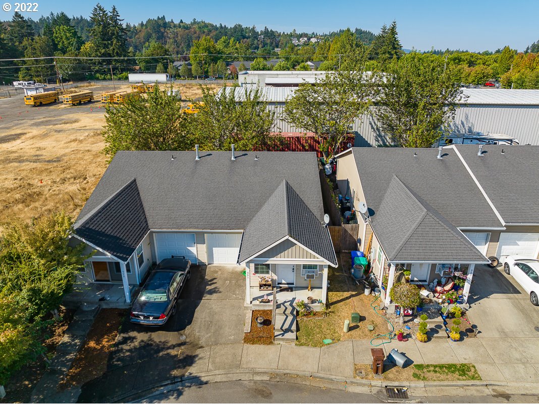 993 Southwest Junction Place Gresham, OR 97080 - Photo 20 of 27 an aerial view of a house with a yard pool outdoor seating and yard