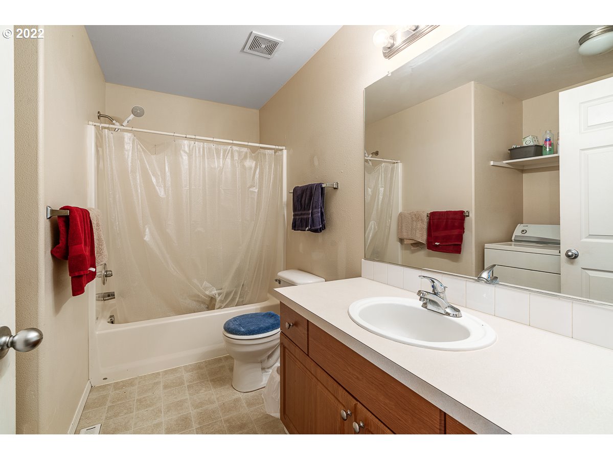 993 Southwest Junction Place Gresham, OR 97080 - Photo 10 of 27 a bathroom with a sink toilet and shower